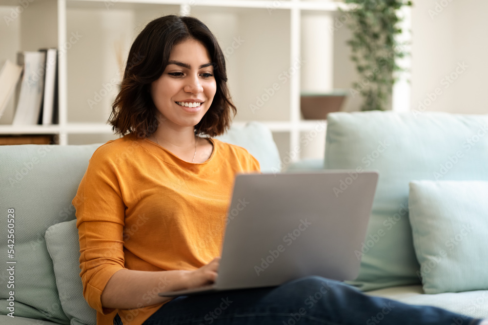 Freelance Concept. Smiling Young Arab Female Working With Laptop At Home Freelance Concept. Smiling Young Arab Female Working With Laptop At Home