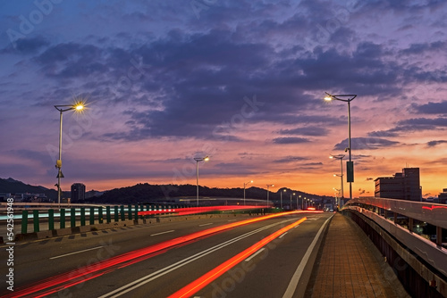 Car light trails on Minquan bridge at sunrise     © lcc54613