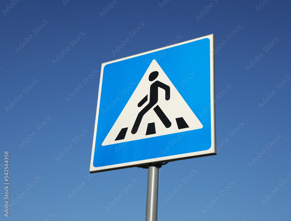 traffic sign Pedestrian Crossing against blue sky, low angle view traffic sign Pedestrian Crossing against blue sky, low angle view