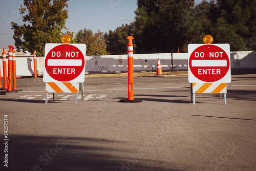 Obraz na plátně Road construction with safety cones and do not enter sign