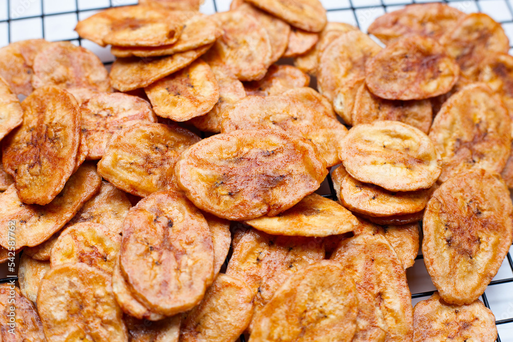 Banana chips on white background Banana chips on white background