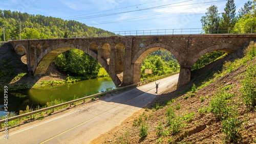 Nikolsky Stone Railway Bridge is one of the main decorations on the road from Sim to Asha on a sunny summer day.