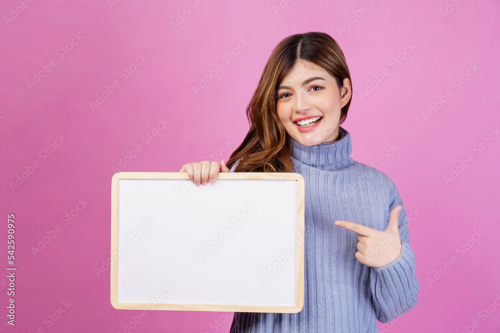 Portrait of Happy young woman holding an empty white placard over isolated pink background. Portrait of Happy young woman holding an empty white placard over isolated pink background.
