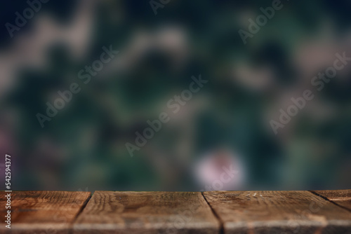 Wooden surface on the background of a blurred backdrop
