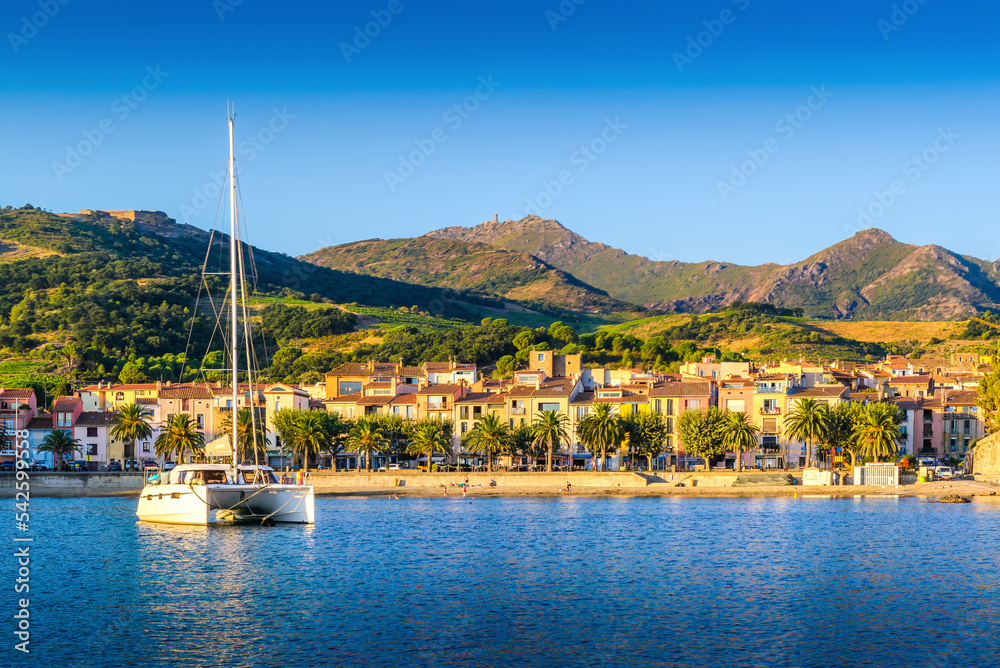 Collioure city and harbor with boats and morning lights in France