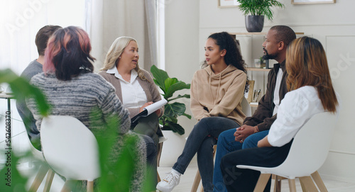 Diversity, mental health and group therapy counseling support meeting, healthy conversation and wellness. Psychology counselor, psychologist help people and talk about anxiety, depression or stress photo