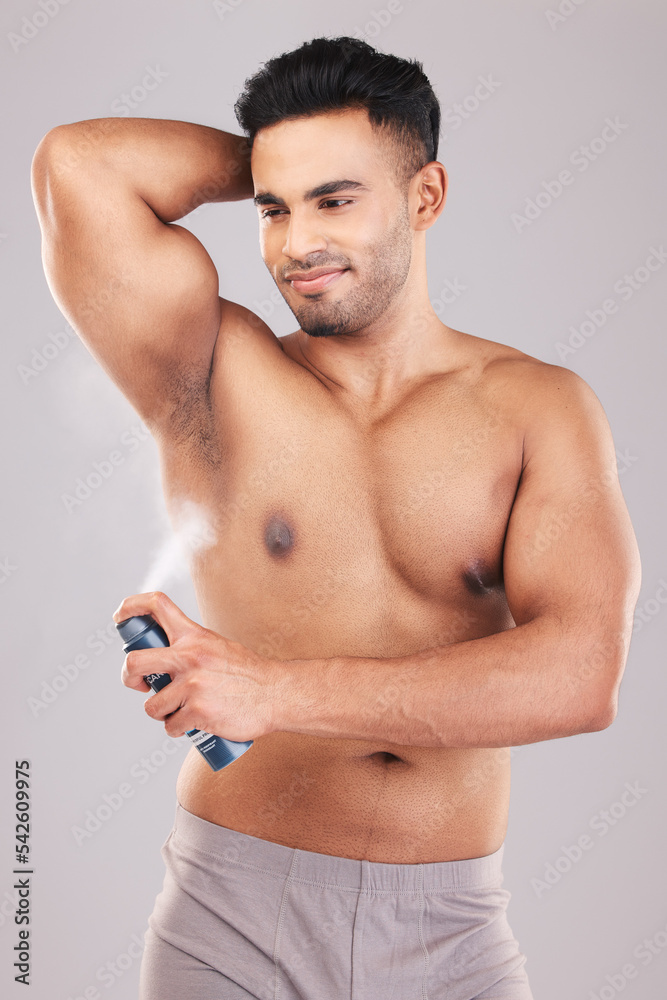 Fototapeta premium Man, armpit hygiene and body skincare perfume for healthy lifestyle grooming. Happy person, clean natural wellness and underarm dermatology deodorant spray treatment after shower in studio background