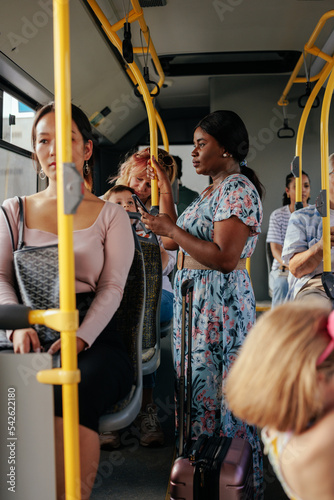 Multiethnic people in crowded city bus