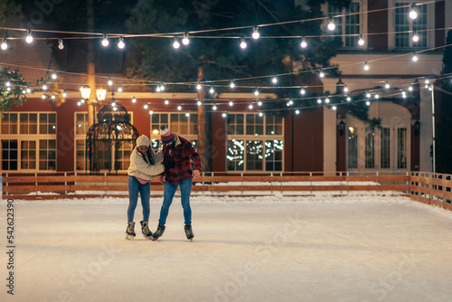 Couple skating during winter season © bernardbodo