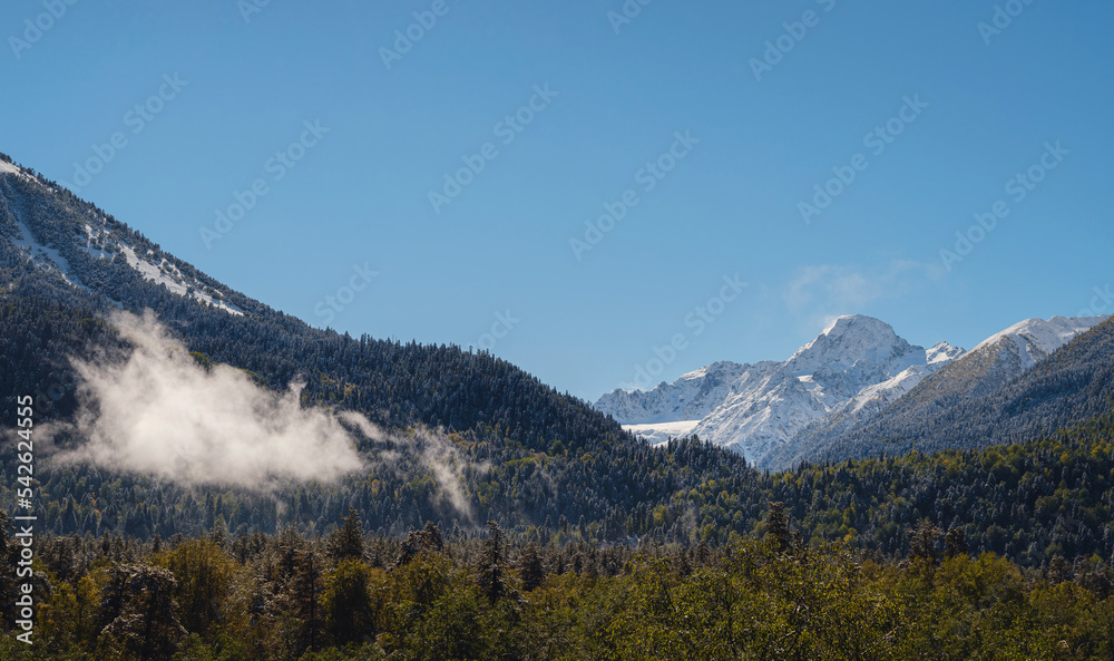 journey by Irkis valley, Arkhyz, Karachay-Cherkessia, North Caucasus. snowy mountain valley with blue sky and clouds and beautiful forest near river Psysh, Caucasus nature reserve. Alpine landscape. journey by Irkis valley, Arkhyz, Karachay-Cherkessia, North Caucasus. snowy mountain valley with blue sky and clouds and beautiful forest near river Psysh, Caucasus nature reserve. Alpine landscape.