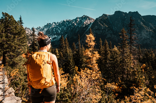 Hiking Strbske lake to popradske lake , very popular hiking destination in High Tatras National park, Slovakia. Autumn color nature . photo