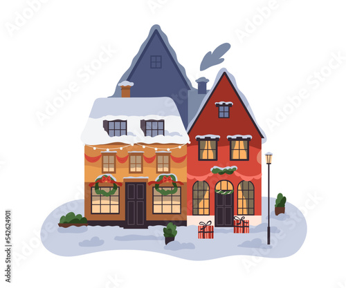 Winter holiday buildings with festive Christmas decoration. European town hou...