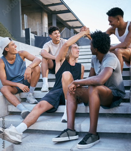 Friends, relax and group of men on building steps after training, exercise and workout in a city. Happy, handshake and sport man greeting guy, bonding and laughing, talking and fitness in New york © Talia M/peopleimages.com