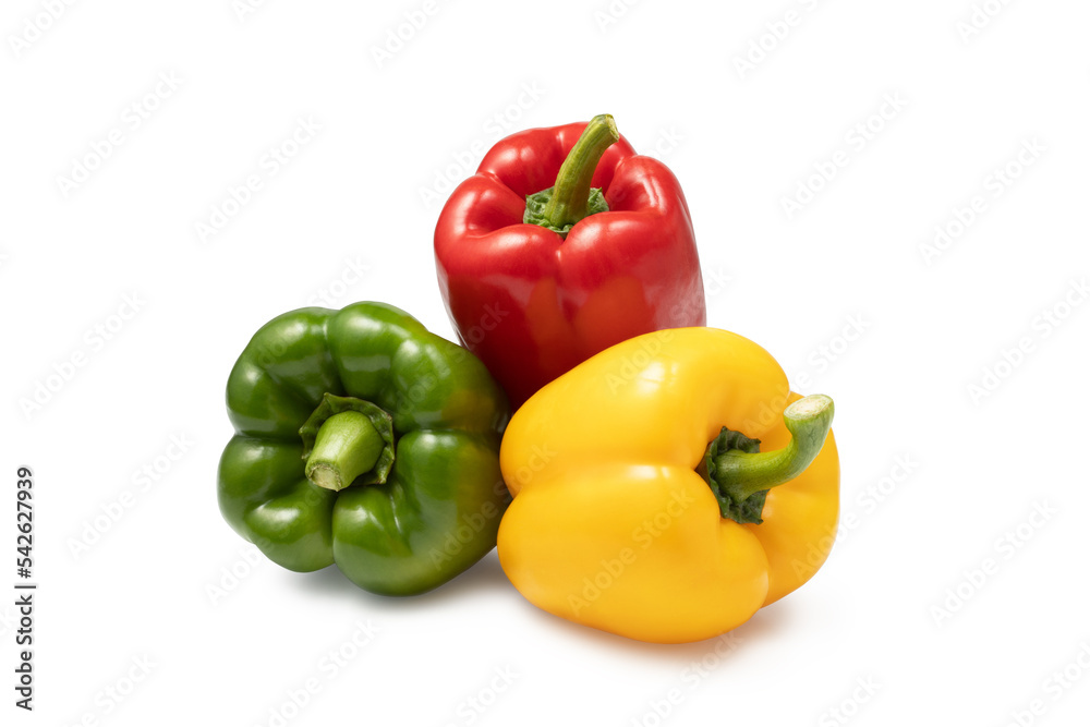 a group of three colored sweet peppers on a white