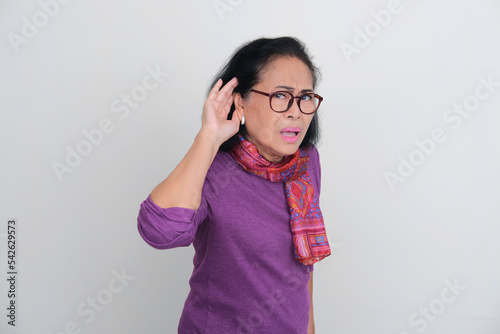 Asian senior women got hearing problem gesture photo