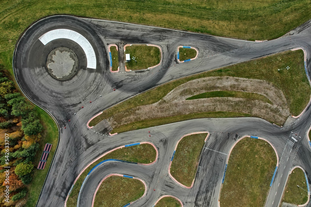 car racing track and racing cars as seen from above from a drone. Fast, luxury cars.
