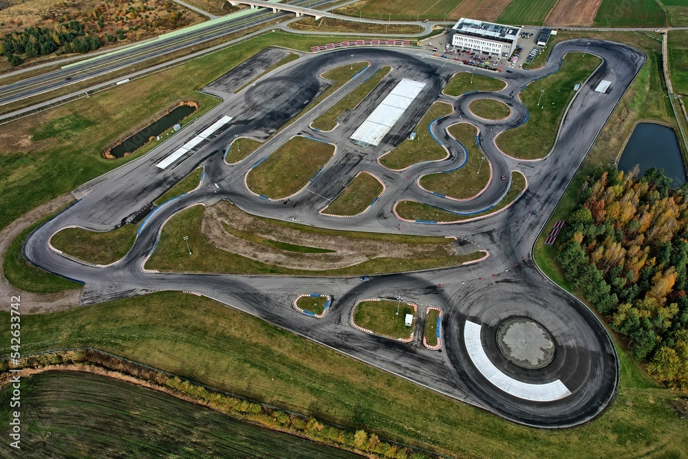 car racing track and racing cars as seen from above from a drone. Fast, luxury cars.