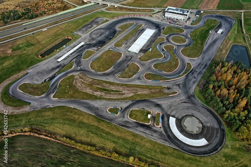car racing track and racing cars as seen from above from a drone. Fast, luxury cars.