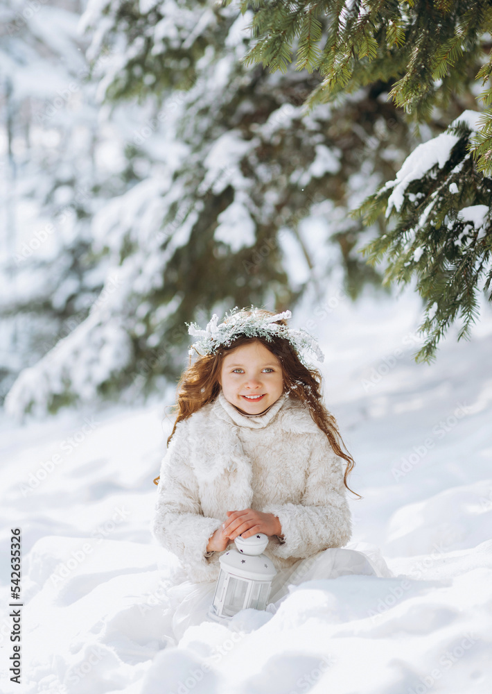 Cute funny kid girl walking in snowy park over nature background outdoors. Cute funny kid girl walking in snowy park over nature background outdoors.