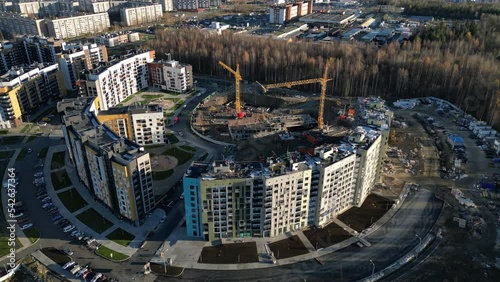 City block at autumn. Modern multi-storey buildings. Construction of a multi-storey building. Aerial photography.