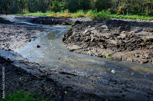 stream cleaning. to clean the pond from alluvium of mud floated from the surrounding fields. floods will be solved by dredging the soil from the blocked channel in the floodplain photo