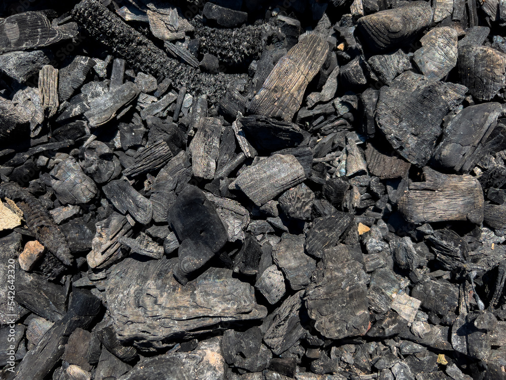 Burned black charcoal as background, top view Burned black charcoal as background, top view