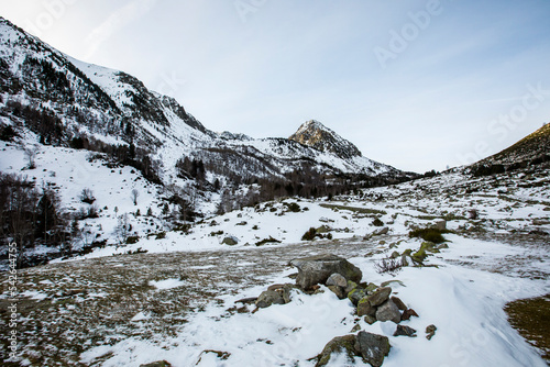 Young boy summit with snowshoes to Peiraforca Peak, Pyrenees, France photo