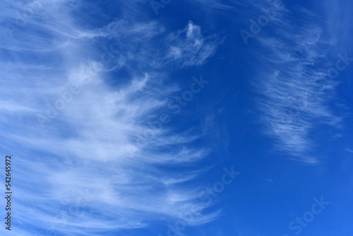 Fluffy white clouds on blue sky