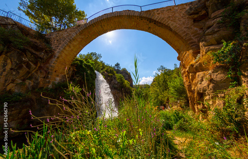 Turkey's waterfalls and rivers. historic stone bridge and waterfall. great photo where nature and architecture meet. Clandras bridge and Clandras waterfall. Usak , Turkey photo