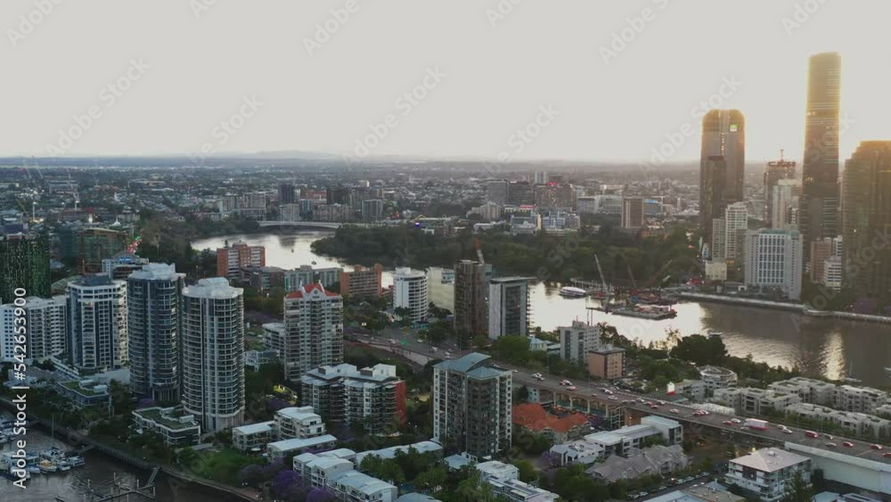 Panoramic aerial shot capturing iconic landmark story bridge and downtown cityscape across inner suburbs from East Brisbane, Kangaroo, central business district and fortitude valley neighborhoods.