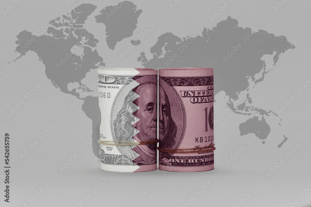 national flag of qatar on the dollar money banknote on the world map
