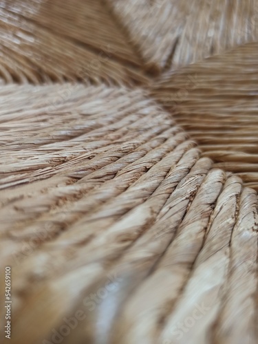 Textured woven straw background in a chair seat photo