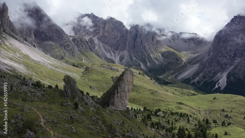 Italian Dolomites with Pieralongia rock formation, cinematic wide establishing view photo