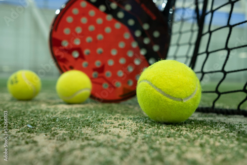 rackets and paddle balls on a court ready to play © FotoAndalucia
