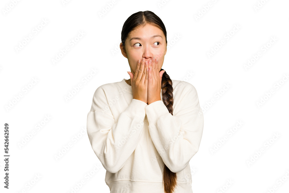 Young Asian woman isolated thoughtful looking to a copy space covering mouth with hand. Young Asian woman isolated thoughtful looking to a copy space covering mouth with hand.