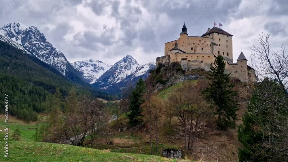 Impressive mountain scenery with amazing medieval castle Tarasp surrounded by Swiss Alps, Canton Grisons or Graubuendon, Switzerland Impressive mountain scenery with amazing medieval castle Tarasp surrounded by Swiss Alps, Canton Grisons or Graubuendon, Switzerland