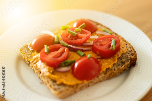 Healthy sandwich with vegan cream and tomatoes