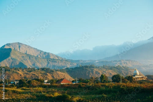 Rural landscape of hills and a residential area around the Rinjani mountain, Sembalun, Indonesia photo