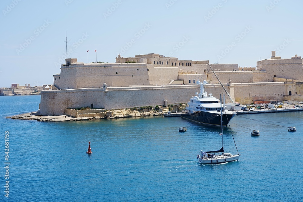 Luxury yachts and fort St Angelo in Birgu city in Malta