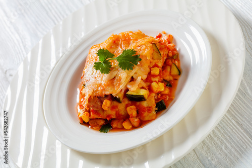 enchilada casserole with veggies, corn, pinto bean photo