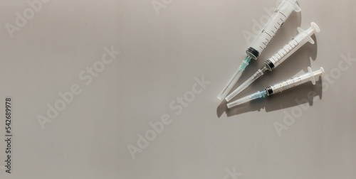 Syringes on a light background. Space for text. View from above. Flatlay.