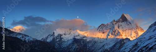 Wide panorama of the Himalaya mountains with Mt. Machapuchare and Annapurna III at sunset  view from Annapurna base camp.