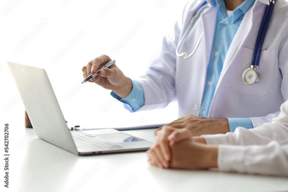 Doctor showing a patient some information on a laptop. Health examination and treatment of disease. Doctor showing a patient some information on a laptop. Health examination and treatment of disease.