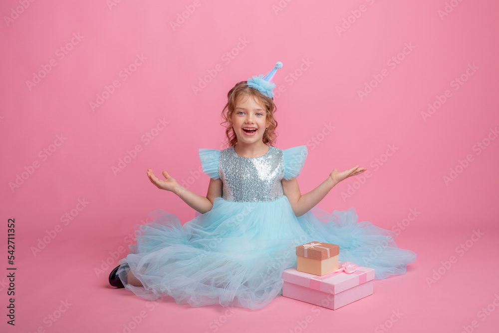 little girl sitting celebrating birthday on pink background, beautiful princess little girl sitting celebrating birthday on pink background, beautiful princess