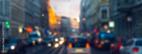 blurred urban traffic in an old city with colorful lights, abstract traffic background concept with copy space for smart cities, electric cars or urban development