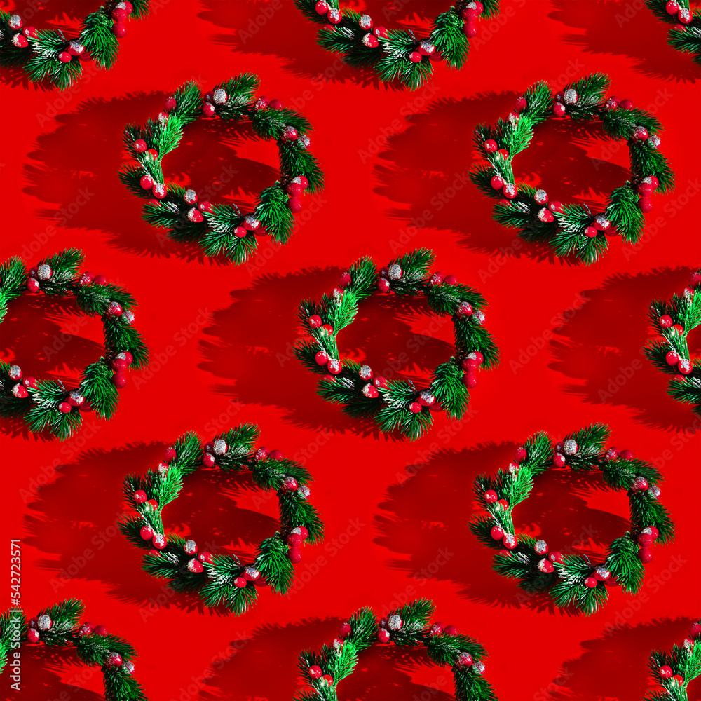 Repeating Christmas wreath pattern with shadow on a red background. Christmas concept
