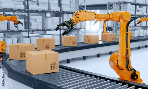 Industrial robot arm grabbing the cardboard box on roller conveyor rack with storage warehouse background. Technology and artificial intelligence innovation concept. 3D illustration rendering photo