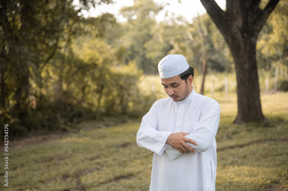 Asian islam man prayer,Young Muslim praying,Ramadan festival concept Asian islam man prayer,Young Muslim praying,Ramadan festival concept