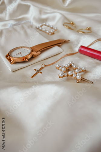 woman jewelry on the white textile background