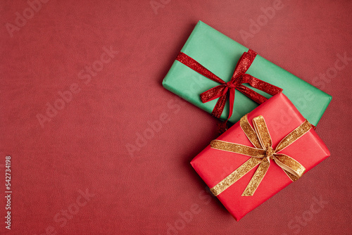 Christmas background with gift boxes. Xmas celebration, preparation for winter holidays, secret Santa concept. Festive mockup, top view, flat lay